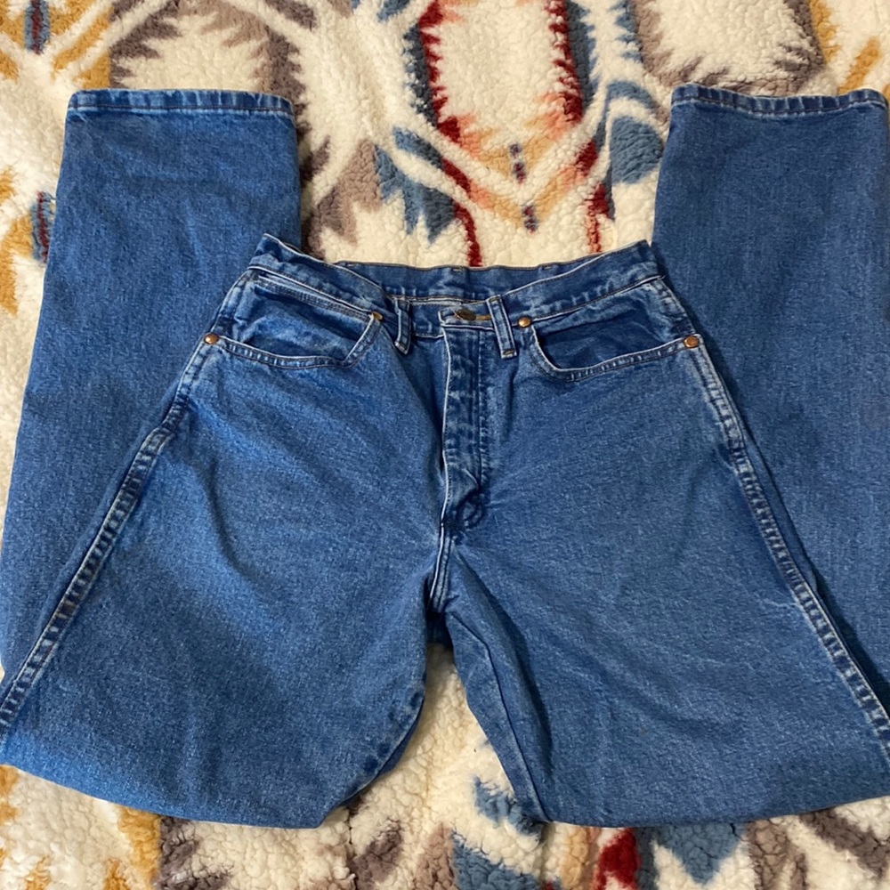 Brand: Wrangler. Style: Cowboy Cut Slim Fit in Stonewash. Size: 7/34.